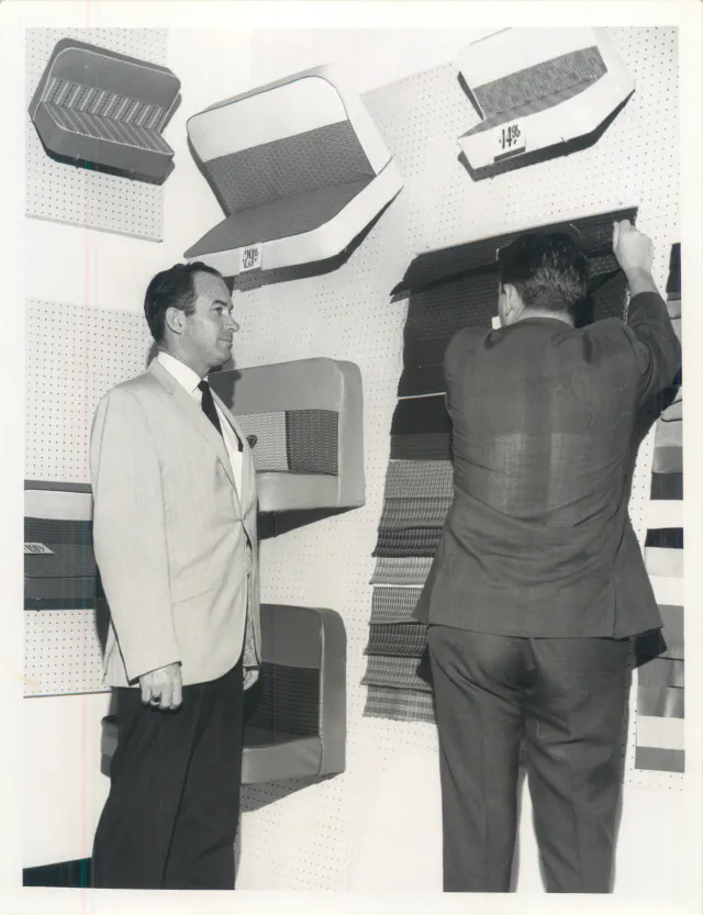 Browsing seat cover samples in the showroom