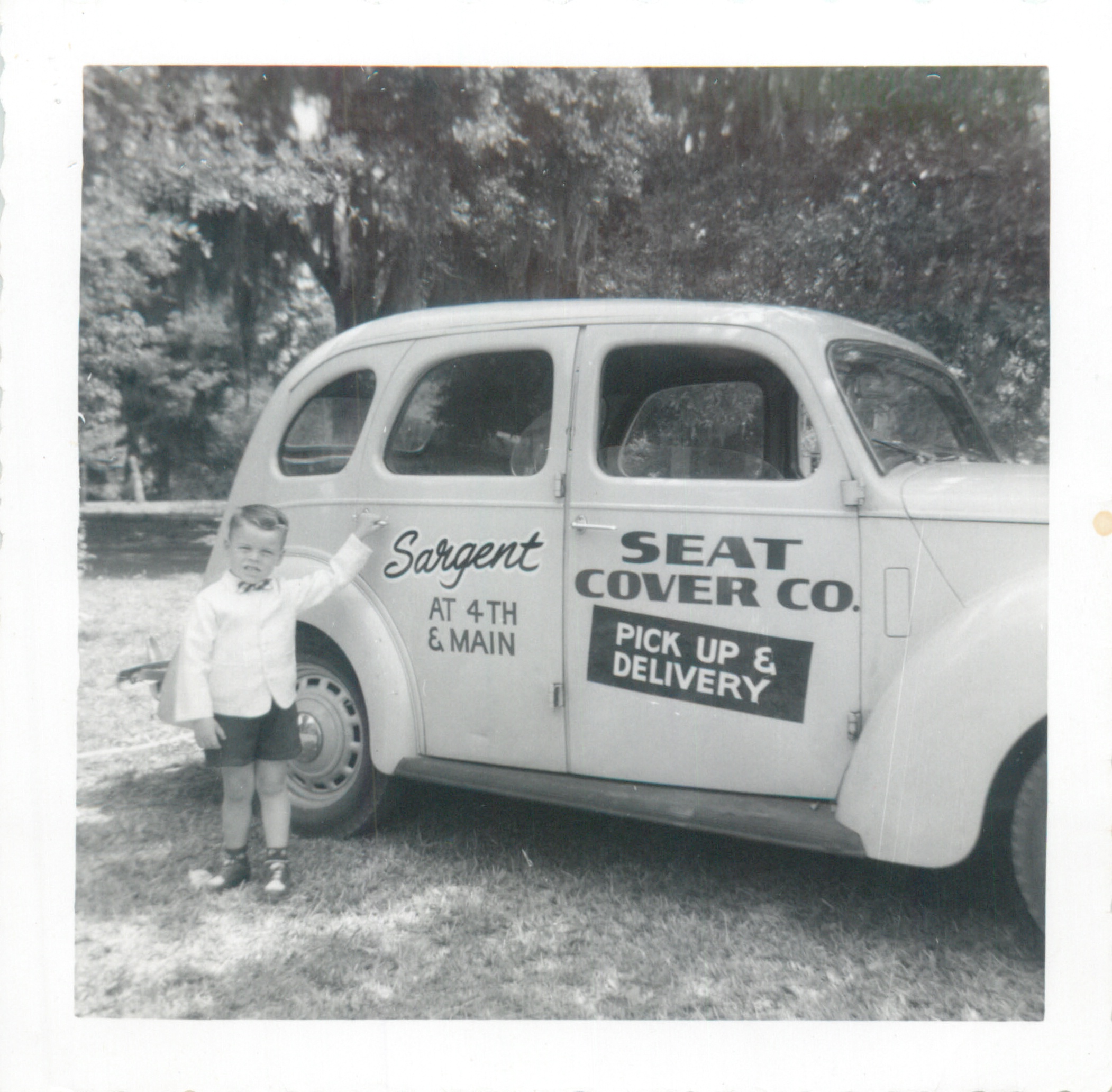 Young Mike Todd with the Sargent Seat Cover Co. delivery car
