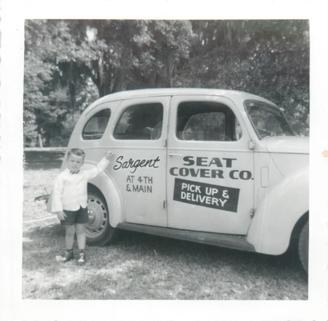 Young Mike Todd with the Sargent Seat Cover Co. delivery car